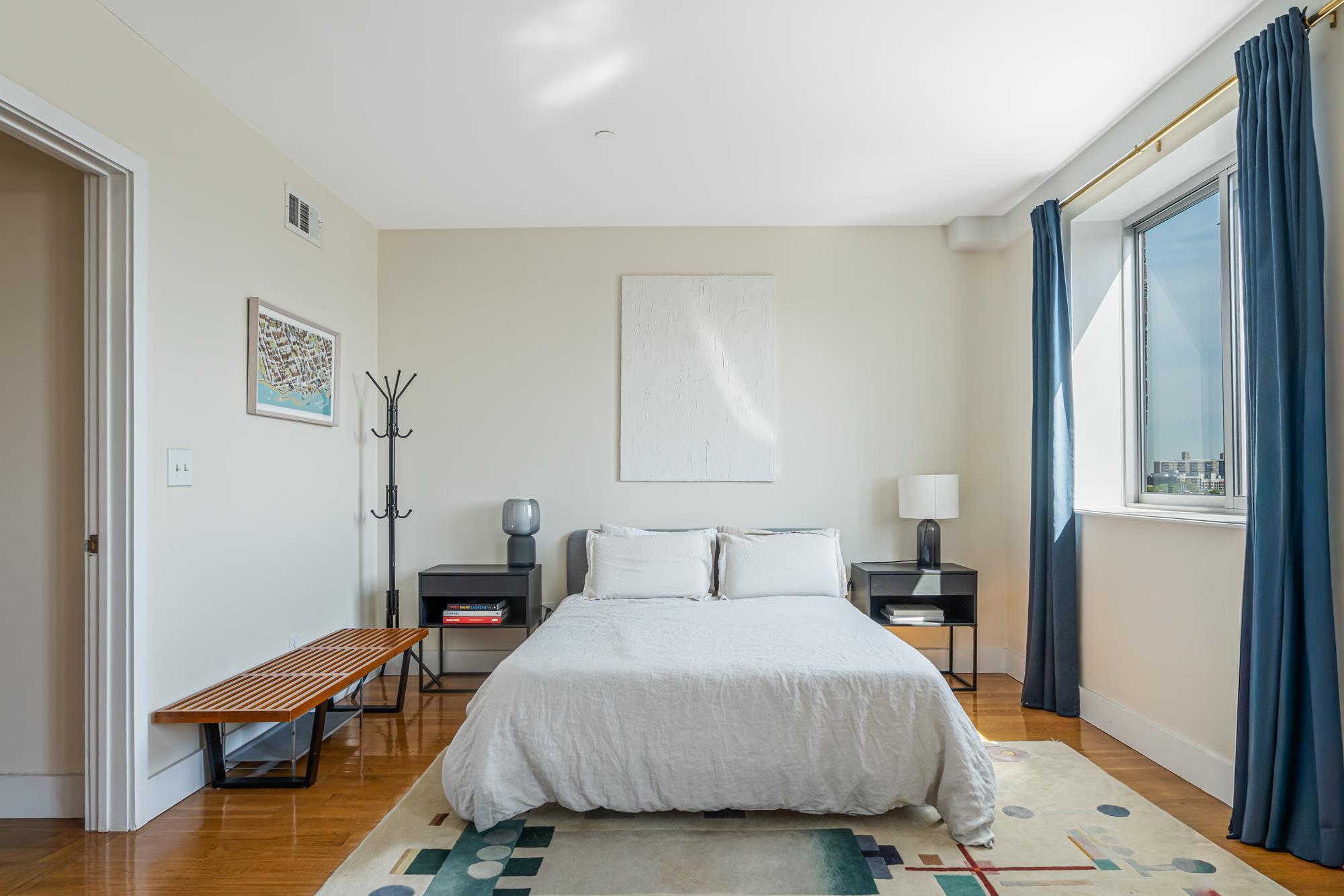 Bedroom with hardwood floors and city views in a Brooklyn, NY condo for sale at 197 Spencer Street #8B — Homes by Agatha