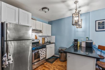 Updated kitchen with stainless steel appliances in a Brooklyn, NY home for sale — Homes by Agatha