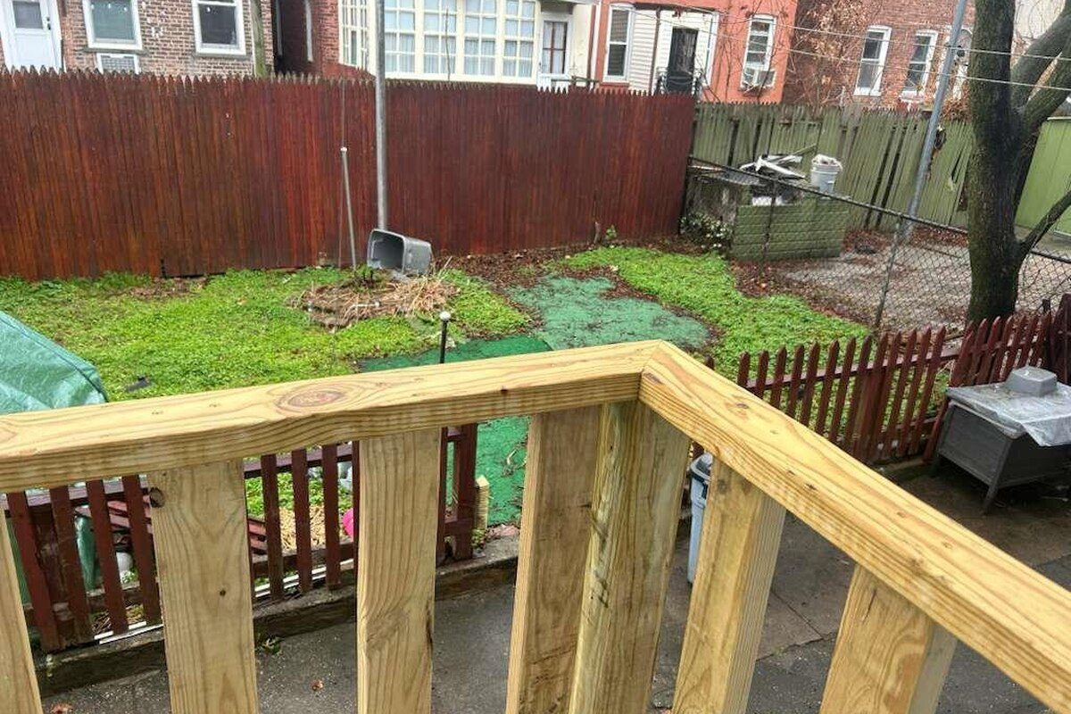 Private backyard and deck of a Woodhaven, Queens NY apartment for rent at 88-23 85th Street — Homes by Agatha