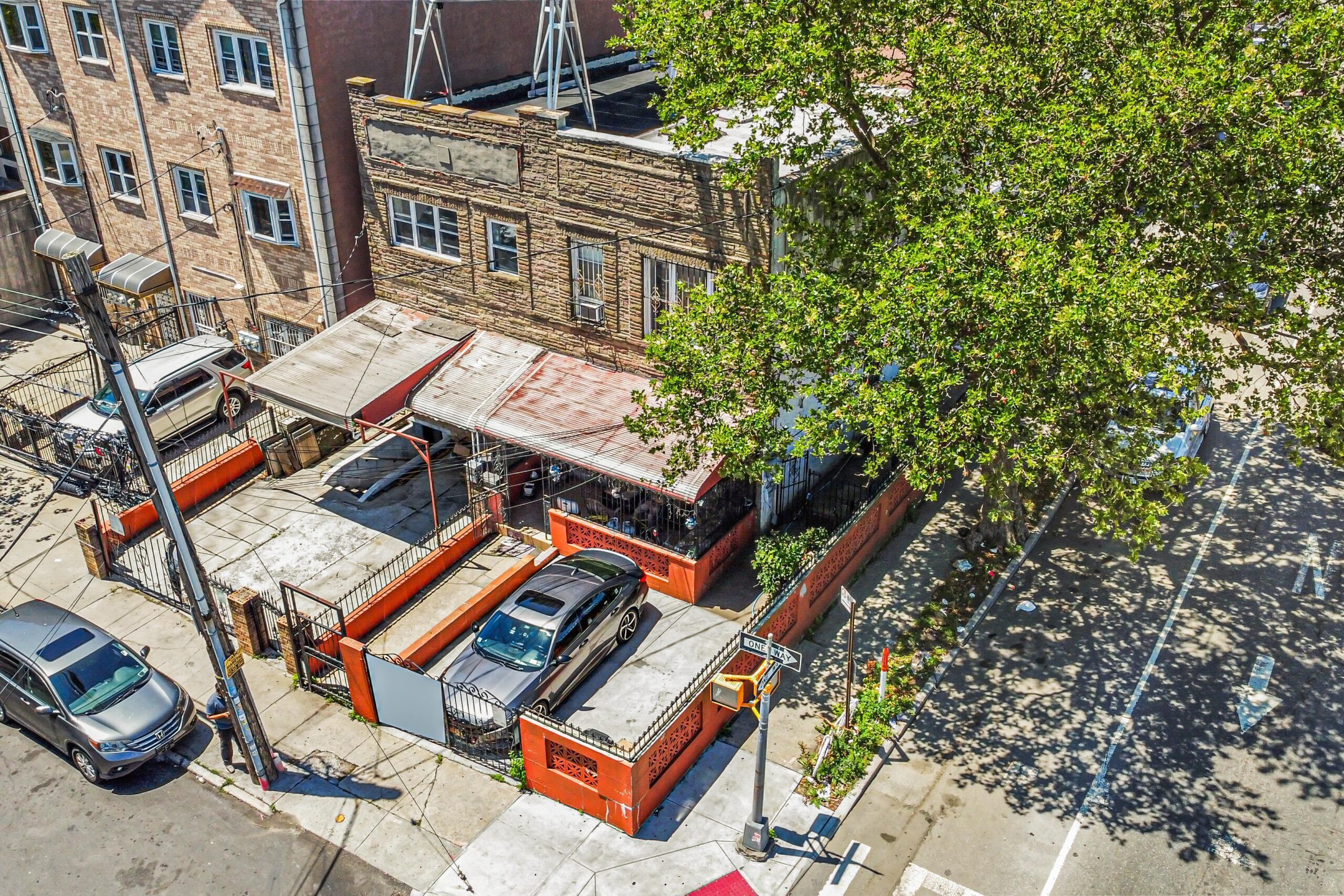 Aerial exterior of a brick home for sale at 708 Snediker Avenue, Brooklyn, NY — Homes by Agatha