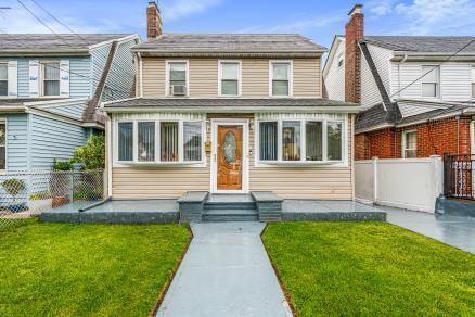 Front exterior of a colonial home for sale at 212-16 93rd Avenue, Queens Village, NY — Homes by Agatha