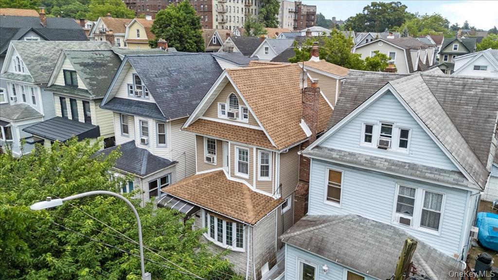 Single-family home sold in Richmond Hill, NY 11418 — 84-31 107th Street aerial | recently sold Queens homes | Homes by Agatha