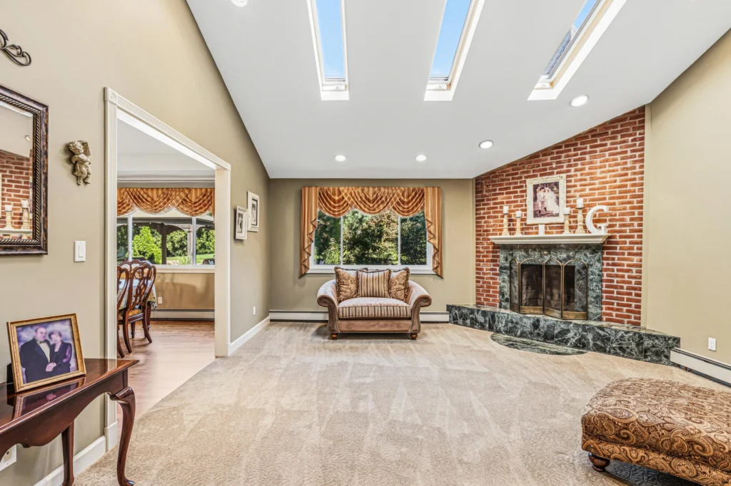 Homes for sale in Smithtown, NY 11787 — 31 Dehan Street living room with brick fireplace