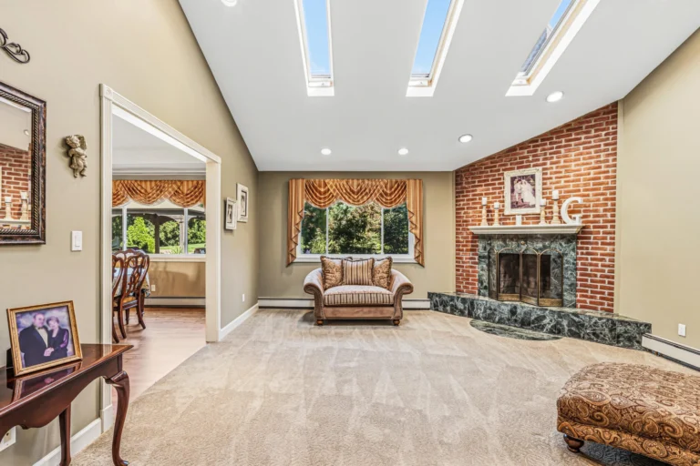 Homes for sale in Smithtown, NY 11787 — 31 Dehan Street living room with brick fireplace | Suffolk County real estate | Agatha Lubas, Homes by Agatha
