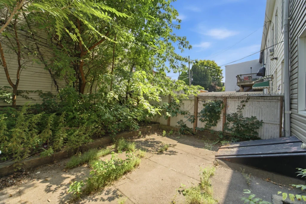 Two-family house Maspeth Queens backyard — 54-18 Nurge Avenue